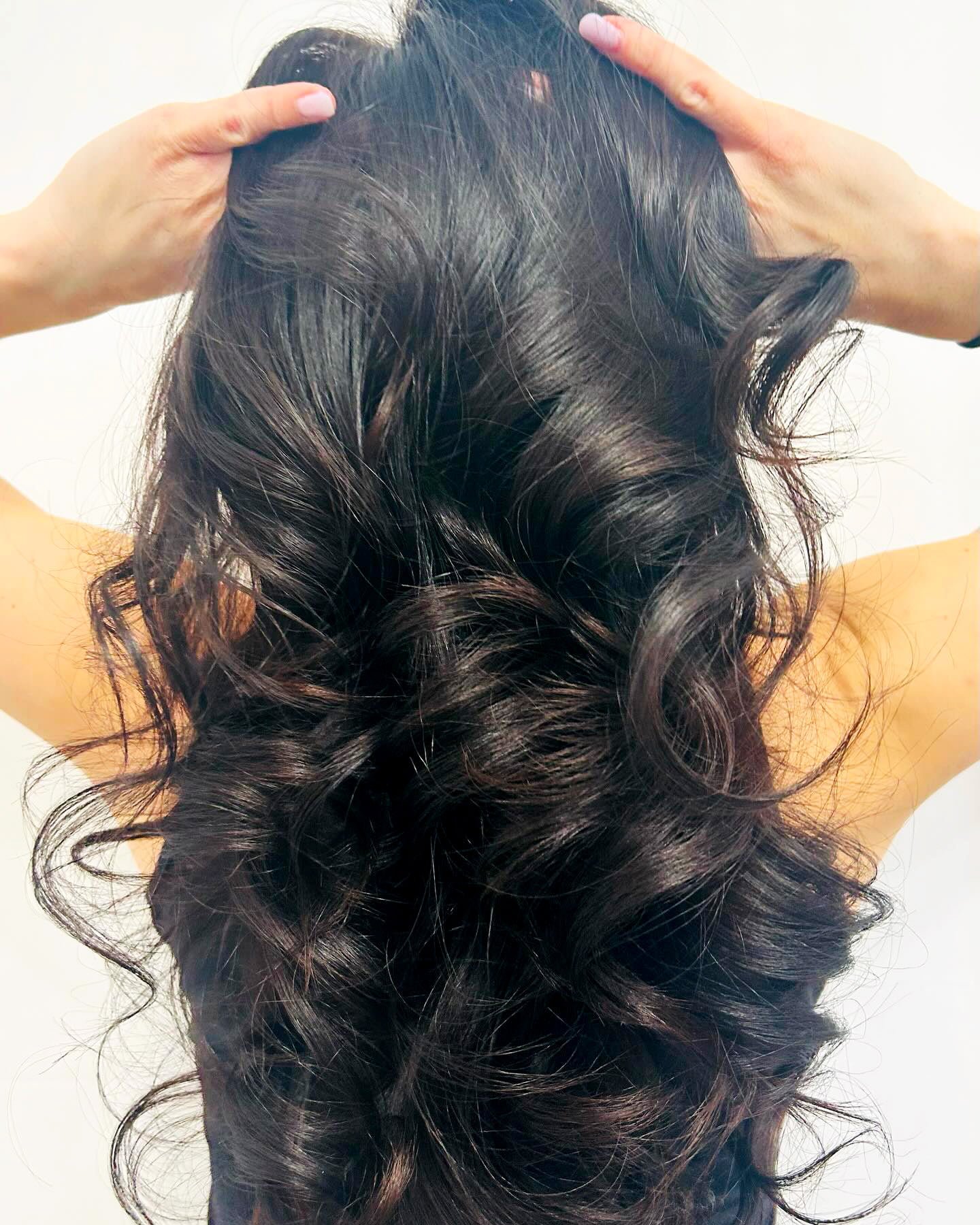 very beautiful long silky hair and hands passing through it