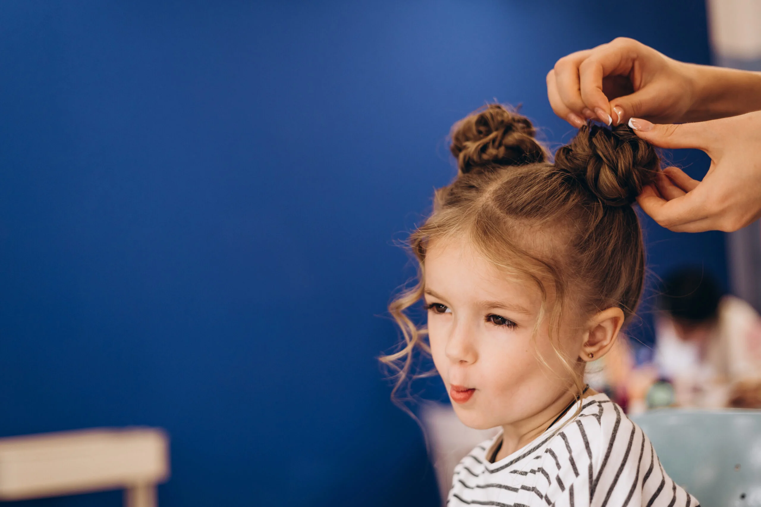 portrait little beautiful girl with stylish hairstyle beauty salon process making child s hair